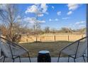 This backyard features a patio seating area and grass providing space for outdoor enjoyment at 3121 S Tamarac Dr # 102, Denver, CO 80231