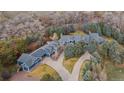 Expansive estate with lush landscaping, mature trees, and a long private driveway at 2627 E Willamette Ln, Greenwood Village, CO 80121