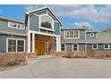 Stunning home with stone accents, grand entrance, and manicured front yard at 2627 E Willamette Ln, Greenwood Village, CO 80121