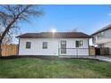 Charming home with a well-maintained lawn, dark trim, and a cozy front porch at 3073 S Elati St, Englewood, CO 80110