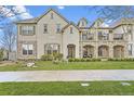 Attractive multi-story home featuring stone accents, balconies, and well-maintained landscaping at 9907 Martin Luther King Blvd # 103, Denver, CO 80238