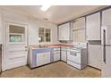 A well-appointed kitchen featuring classic appliances and practical layout for cooking at 1000 Salem St, Aurora, CO 80011