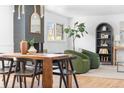 Inviting living room featuring hardwood floors, a painted brick fireplace, comfortable seating, and stylish decor at 417 S Pontiac Way, Denver, CO 80210