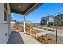 View from the front porch looking out onto a landscaped walking path in a quiet neighborhood at 3334 N Catawba Way, Aurora, CO 80019