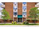The entrance to San Marco North building has an inviting facade with lush greenery and well-kept surroundings at 850 20Th St # 203, Boulder, CO 80302