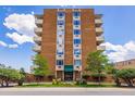 A well-maintained brick apartment building with manicured landscaping, exuding charm and curb appeal at 850 20Th St # 203, Boulder, CO 80302