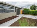 Side exterior of the home showcasing the fresh landscaping, fence, and garage at 740 Moline St, Aurora, CO 80010