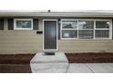 Close-up of the front door and entrance of the house, highlighting the house number and new mulch at 740 Moline St, Aurora, CO 80010