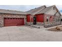 A spacious home featuring an attached garage and well-manicured landscaping at 12717 Madison Ct, Thornton, CO 80241