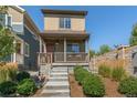 Charming home with a covered porch and well-maintained landscaping at 12794 Tamarac St, Thornton, CO 80602