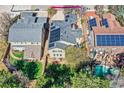 An aerial shot of a home equipped with solar panels and a backyard pool at 10908 Oakshire Ave, Highlands Ranch, CO 80126