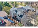 Stylish two-story home showcasing unique architectural details and a well-maintained yard at 10908 Oakshire Ave, Highlands Ranch, CO 80126