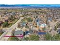 Overview of a peaceful neighborhood with stunning mountain views at 10908 Oakshire Ave, Highlands Ranch, CO 80126