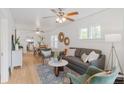 Bright living room with hardwood floors and modern furnishings at 3052 S Logan St, Englewood, CO 80113