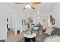 Spacious living room seamlessly connects to the dining area and kitchen at 3052 S Logan St, Englewood, CO 80113