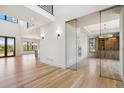 Bright entryway featuring high ceilings, hardwood floors, glass-enclosed office and access to other living areas at 5145 S Kearney Ct, Greenwood Village, CO 80111