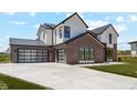 Eye-catching exterior of a modern home featuring a spacious driveway leading to a three-car garage at 5145 S Kearney Ct, Greenwood Village, CO 80111