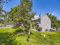 Enjoy the spacious backyard and pool access; perfect for relaxation and outdoor fun at 9736 W Cornell Pl, Lakewood, CO 80227
