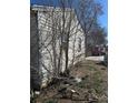 View of side yard showing exterior siding and window at 1165 S Winona Ct, Denver, CO 80219