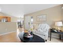 Bright living room featuring contemporary furnishings and light hardwood floors, perfect for relaxing at 8406 Pebble Creek Way # 202, Highlands Ranch, CO 80126