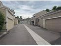 Row of townhome garages in a well-maintained community, showcasing convenient parking at 5898 W Asbury Pl, Lakewood, CO 80227