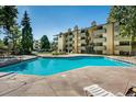 Sparkling pool and sunbathing area with chaise lounge seating in a well-maintained complex at 3035 Oneal Pkwy # 35T, Boulder, CO 80301
