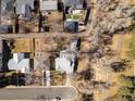 A high angle captures a cozy home, framed by bare trees and manicured lawns in a quiet neighborhood at 3145 S Ash St, Denver, CO 80222