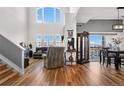 Bright living room with vaulted ceilings, large windows, and hardwood flooring at 8944 Fox Dr, Denver, CO 80260