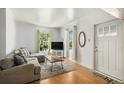 Bright living room featuring wood floors, natural light, and comfortable seating perfect for relaxing at 3768 S Acoma St, Englewood, CO 80110