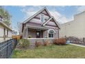 Beautiful home boasting a well-kept lawn and eye-catching architectural elements and a covered porch at 2224 N Humboldt St, Denver, CO 80205