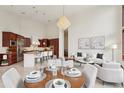 Open concept space with a gourmet kitchen, dining area, and comfortable living space at 6180 E Quincy Ave, Cherry Hills Village, CO 80111