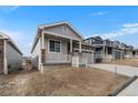 Charming single-Gathering home features stone accents, covered porch, and attached two car garage at 2149 Peralta Loop, Castle Rock, CO 80104