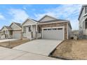 Charming single-Gathering home features stone accents, covered porch, and attached two car garage at 2149 Peralta Loop, Castle Rock, CO 80104