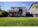 Expansive backyard featuring multiple decks and green space, perfect for outdoor enjoyment at 22739 E Prentice Pl, Aurora, CO 80015