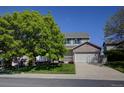 Attractive two-story home with a well-kept lawn, offering a welcoming curb appeal and a two-car garage at 22739 E Prentice Pl, Aurora, CO 80015