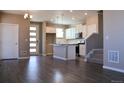 Open-concept kitchen boasts stainless appliances and center island at 21795 E 8Th Ave, Aurora, CO 80018