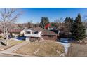 Top-down view of a ranch house with a yard and driveway at 6740 S Clarkson St, Centennial, CO 80122