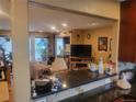 Open concept living room viewed from the kitchen with ample space for entertaining guests or Gathering at 2190 S Holly St # 213, Denver, CO 80222