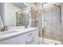 Modern bathroom featuring double sinks, walk-in shower, and contemporary finishes at 852 Kalamath St, Denver, CO 80204