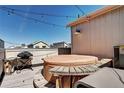 Relax on this rooftop deck with a grill and hot tub for outdoor entertainment at 852 Kalamath St, Denver, CO 80204