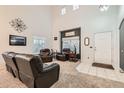 Spacious living room with high ceilings, plush carpeting, and a comfortable leather sofa set at 1793 E 164Th Pl, Brighton, CO 80602