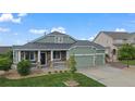 Charming single-Gathering home featuring a well-manicured lawn and a welcoming front porch at 42013 Big Horn Cir, Elizabeth, CO 80107