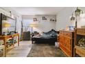 Bedroom with modern flooring, neutral walls, and natural light at 3320 S Ammons St # 104, Lakewood, CO 80227