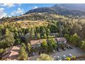 Condominium complex situated in a wooded area against a mountain backdrop at 350 Arapahoe Ave # 17, Boulder, CO 80302