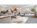 Bright living room featuring an open floor plan and stylish furniture at 605 S Alton Way # 9C, Denver, CO 80247