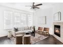 Bright living room featuring a fireplace and ample natural light at 16091 E Geddes Dr # 74, Aurora, CO 80016