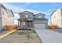 Charming two-story home features a well-maintained lawn and a spacious two-car garage at 6211 Bauer Dr, Frederick, CO 80504