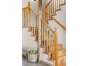 Elegant wooden staircase with natural wood railings and a cozy seating nook at 30717 Conifer Mountain Dr, Conifer, CO 80433