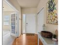Inviting entryway with hardwood floors, ample natural light, and a stylish console table at 1907 Windemere Ln, Erie, CO 80516