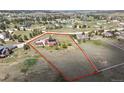 Aerial shot showcases property, highlighting its location and generous land size at 2146 Savage Rd, Elizabeth, CO 80107